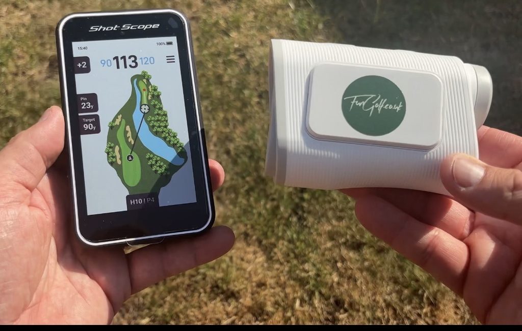 Shot Scope H50 handheld golf GPS being used on a golf course showing a full-colour hole map and yardages