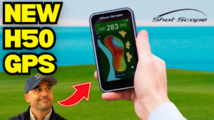 Shot Scope H50 handheld golf GPS being used on a golf course showing a full-colour hole map and yardages