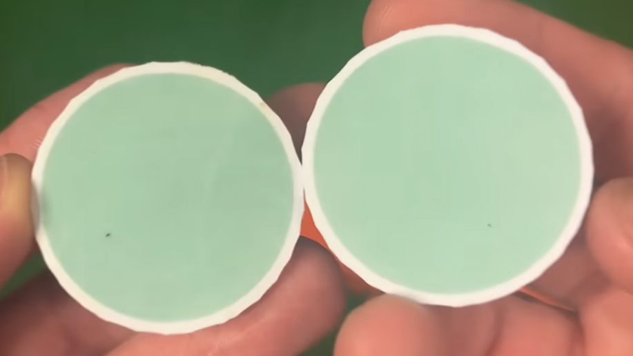 inside the cut open wilson duo soft golf ball in two halves inside is green